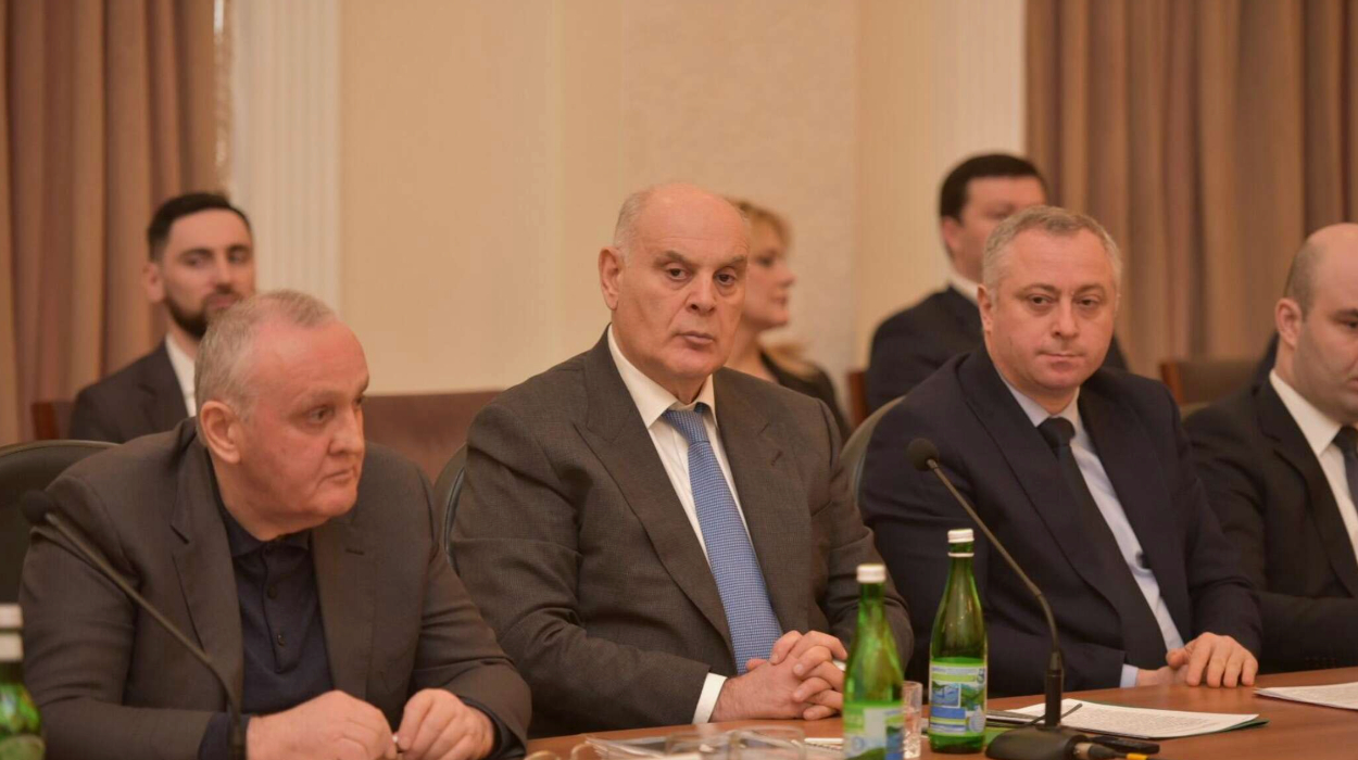President Aslan Bzhania (centre) and his government have long faced criticism for their failed policies. Alexander Ankvab, Aslan Bzhania