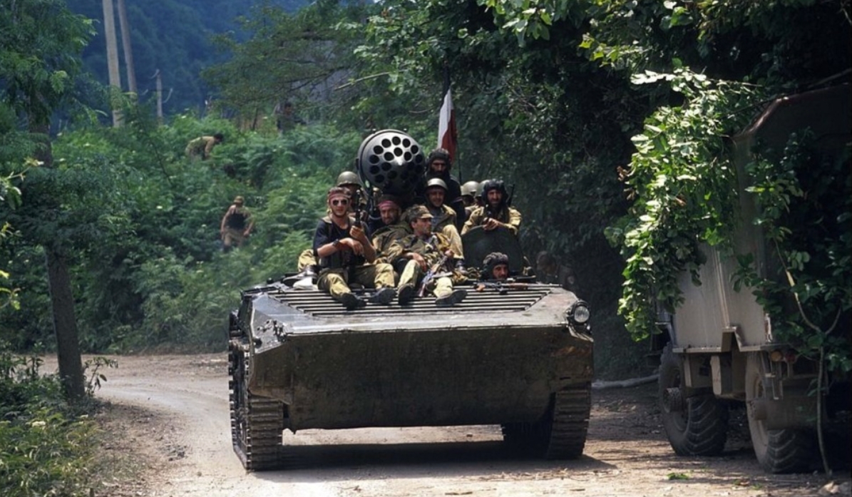 A Georgian armored vehicle drives down a road. July, 1993. Sukhum, Abkhazia A Georgian armored vehicle drives down a road. July, 1993. Sukhum, Abkhazia