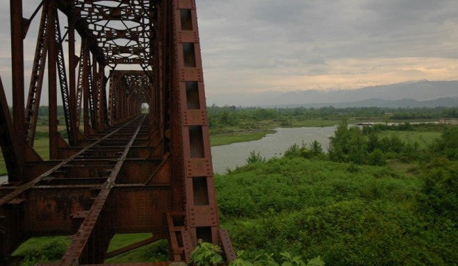 A defunct railroad truss bridge over the Ingur river, which forms the Georgia Abkhazia administrative. The railroad was cut during in 1993 during the Georgian-Abkhazian war.