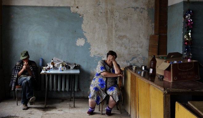 Ossetians inside a building which was partially destroyed during a Georgian assault in August 2008 in Tskhinval