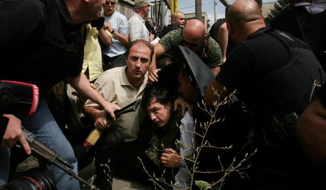 Mikheil Saakashvili, was pushed to the ground by bodyguards when a jet flew overhead during his tour of the Georgian city of Gori