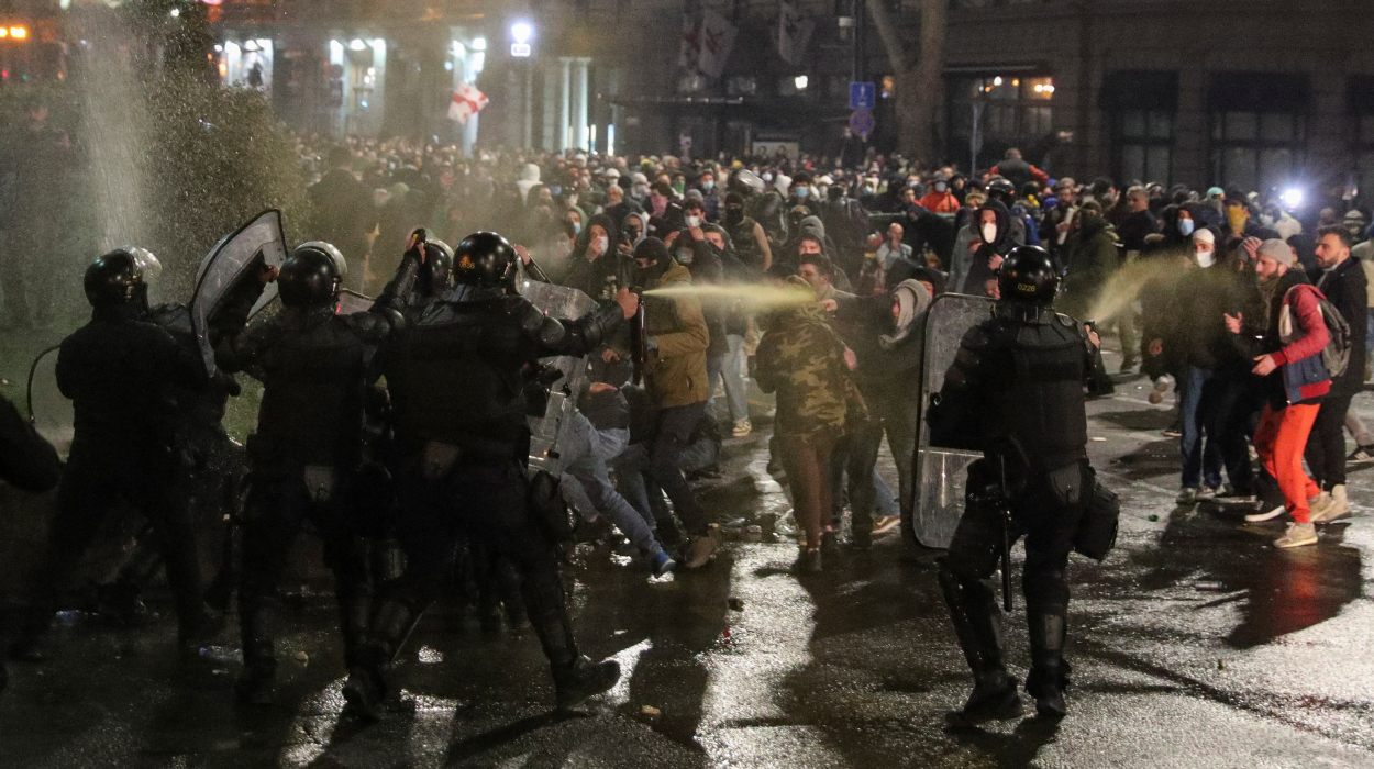 Police use tear gas to disperse protesters during a rally against a draft law on Police use tear gas to disperse protesters during a rally against a draft law on