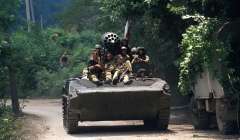 A Georgian armored vehicle drives down a road. July, 1993. Sukhum, Abkhazia